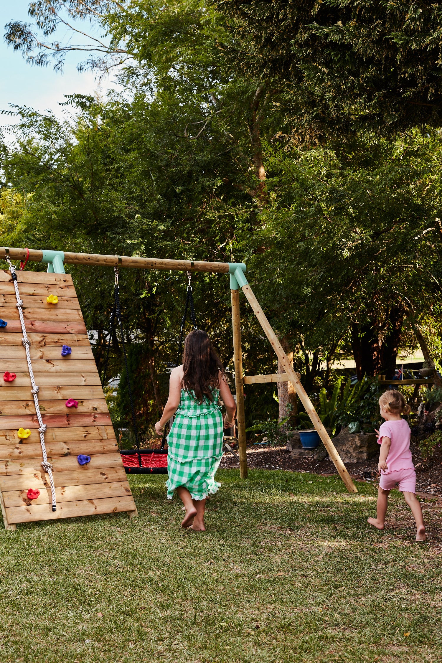 Climbing wall with rope, outdoor swing and climbing net