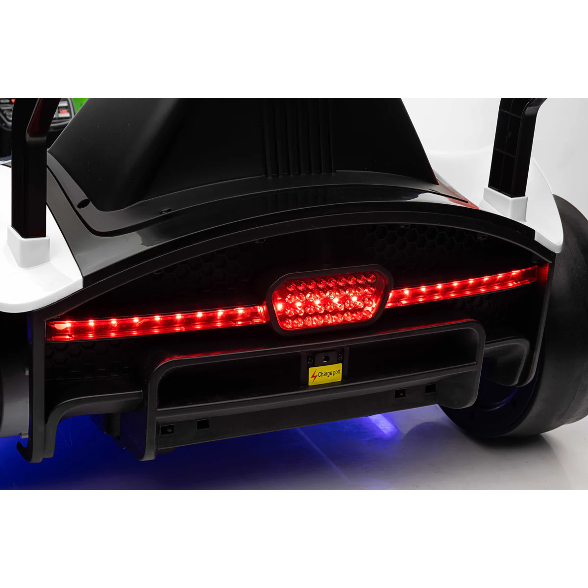 Close-up of a car's rear lights with a visible brand logo on a white background