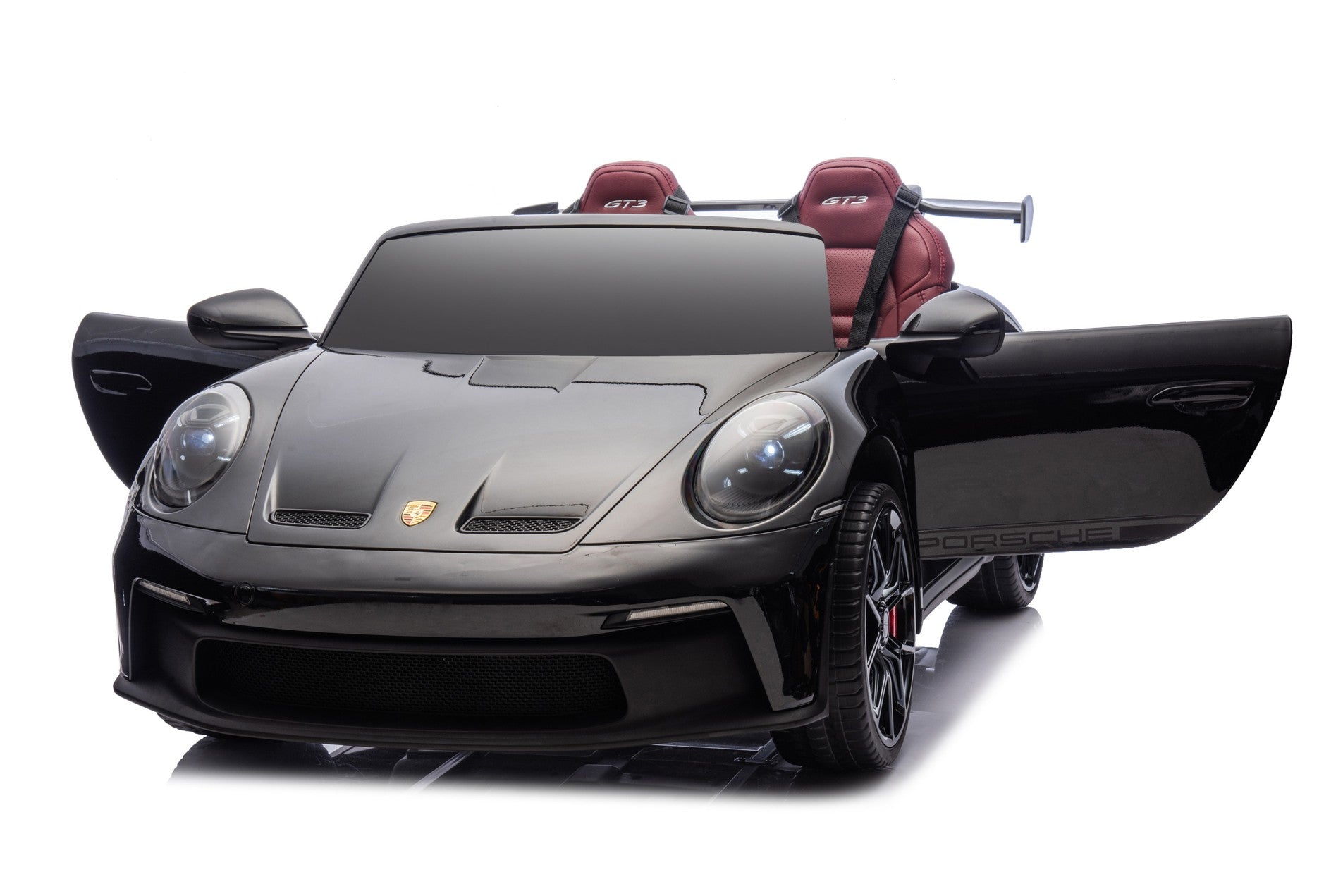 Black toy car with red interior on a white background