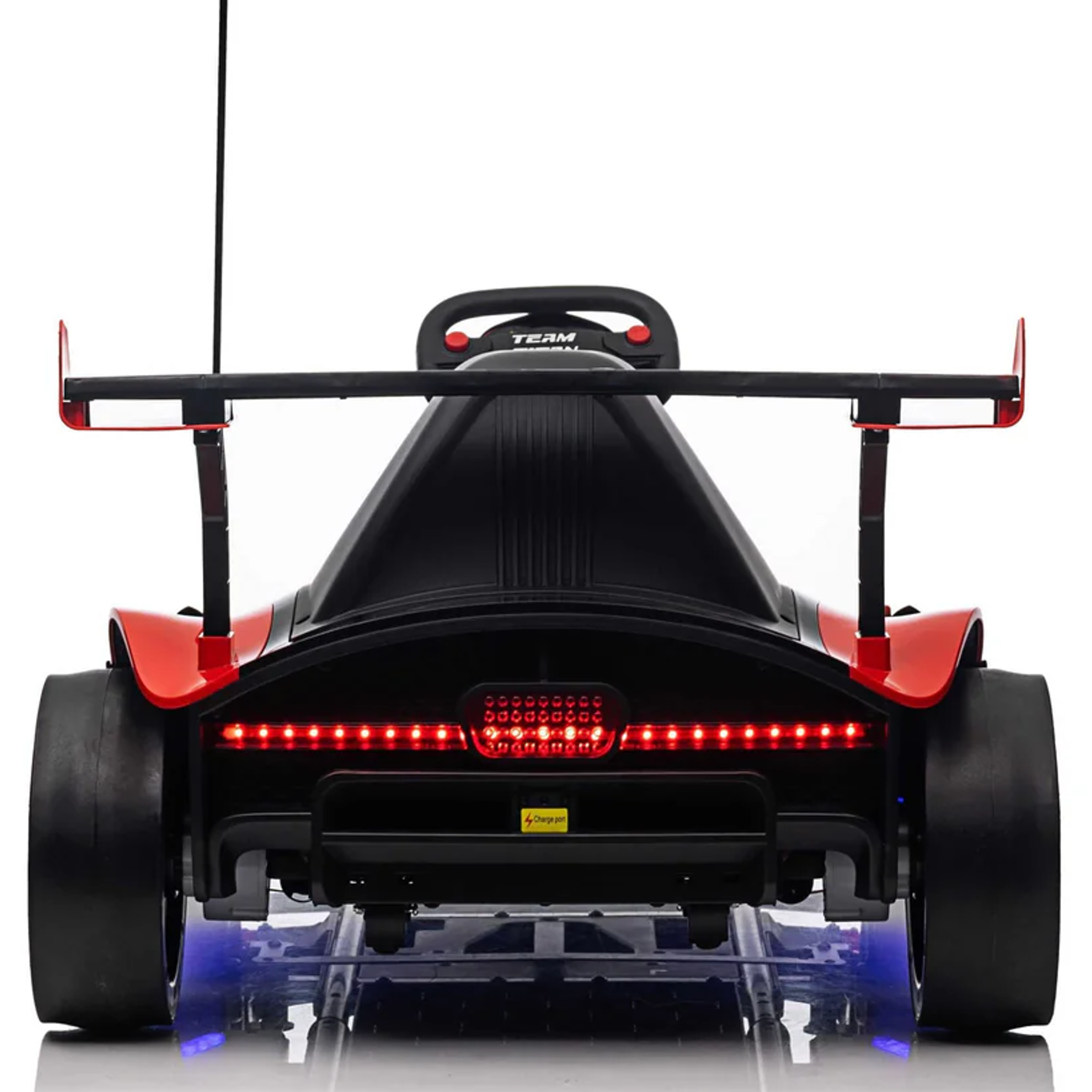 Back view of a toy car with a red flag and visible branding on a white background