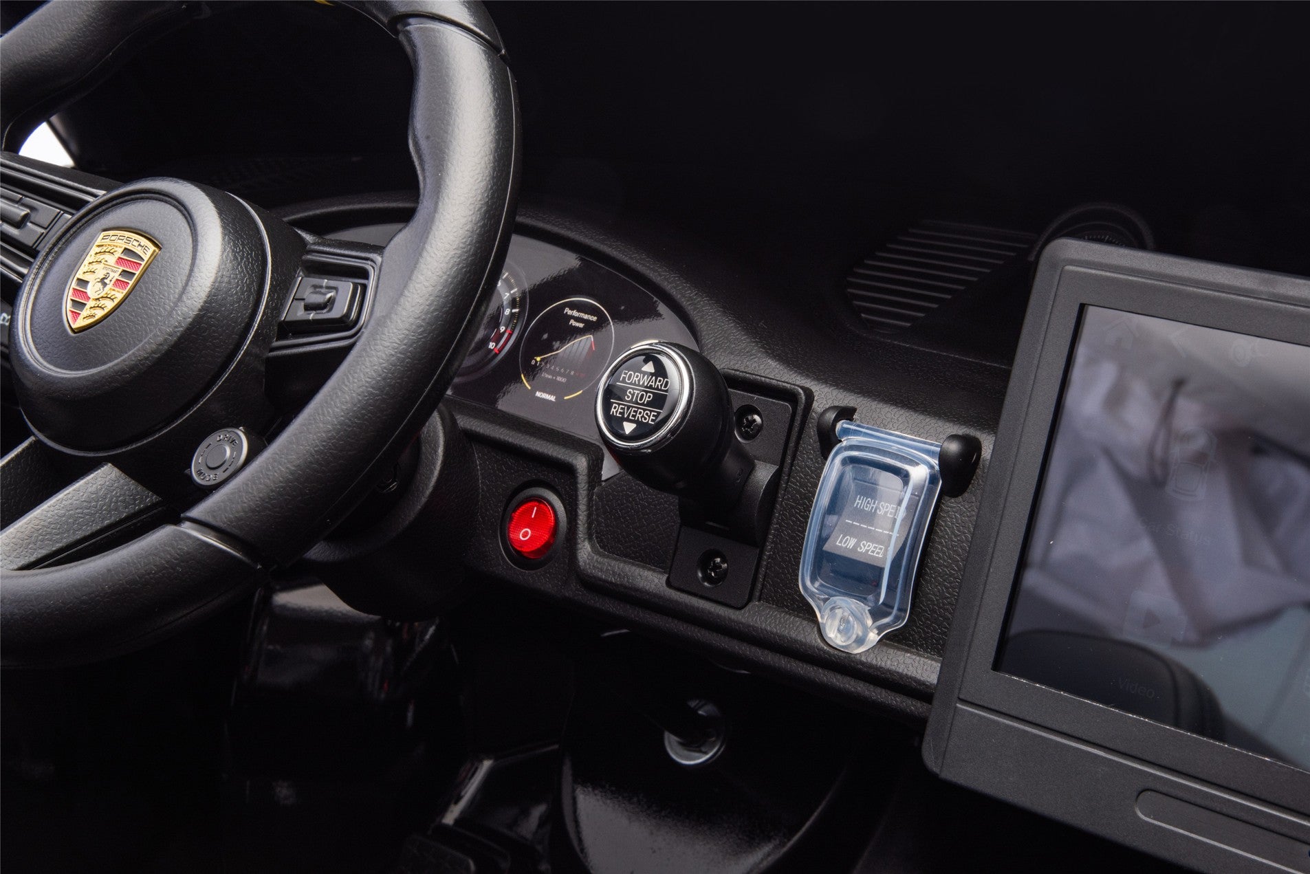 Car interior with steering wheel, dashboard, and navigation screen.