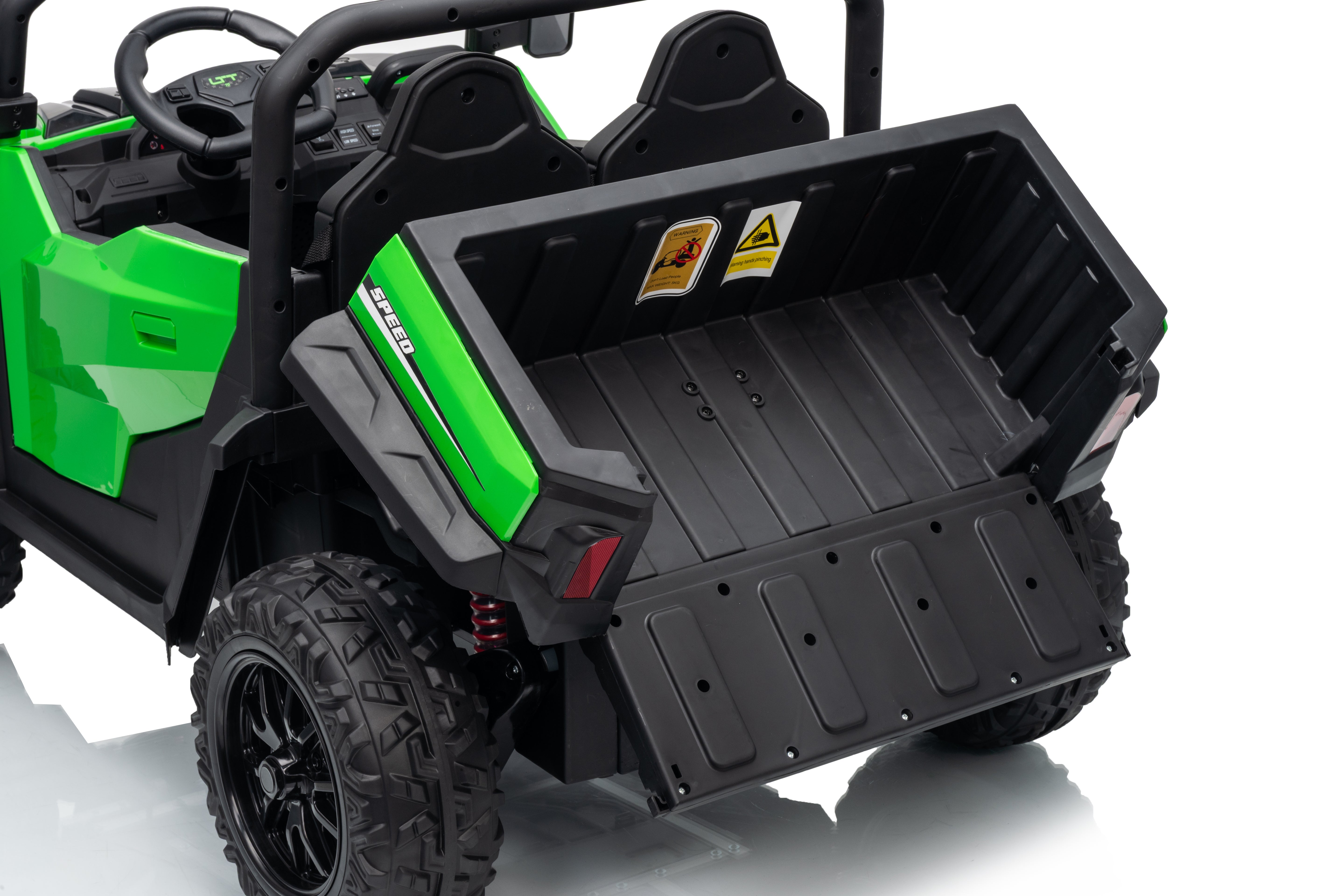 Green and black off-road vehicle with an open tip tray bed on a white background