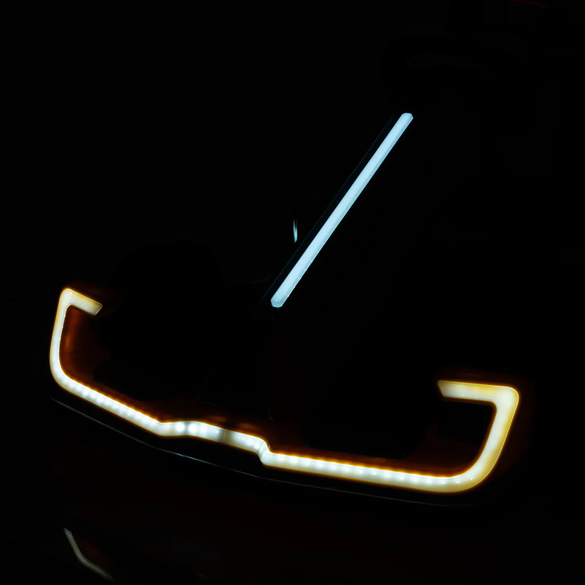 Car grille with illuminated accents on a dark background