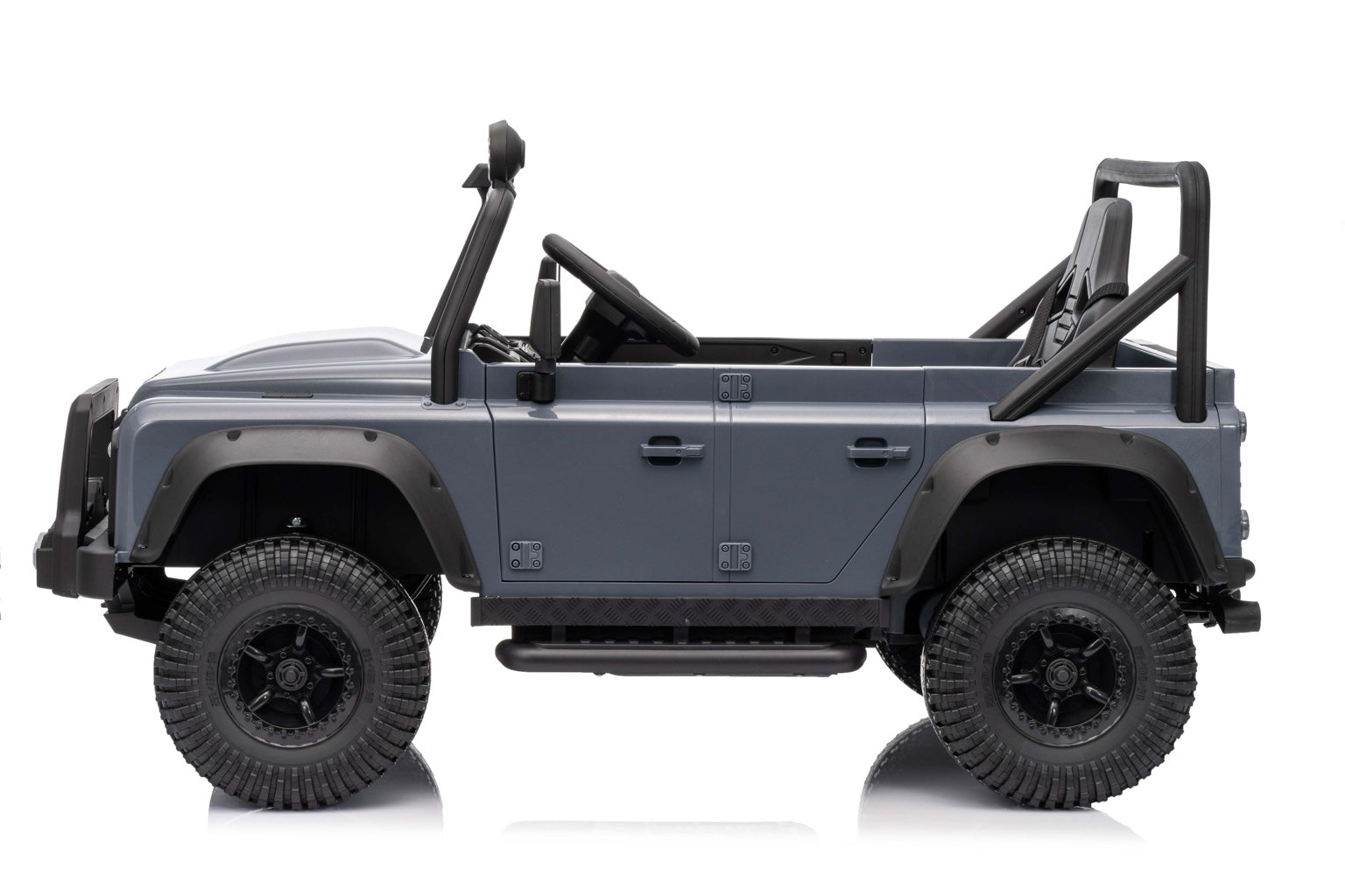 Left side view of the kids Land Rover Defender electric car with rugged tires and roll cage design.
