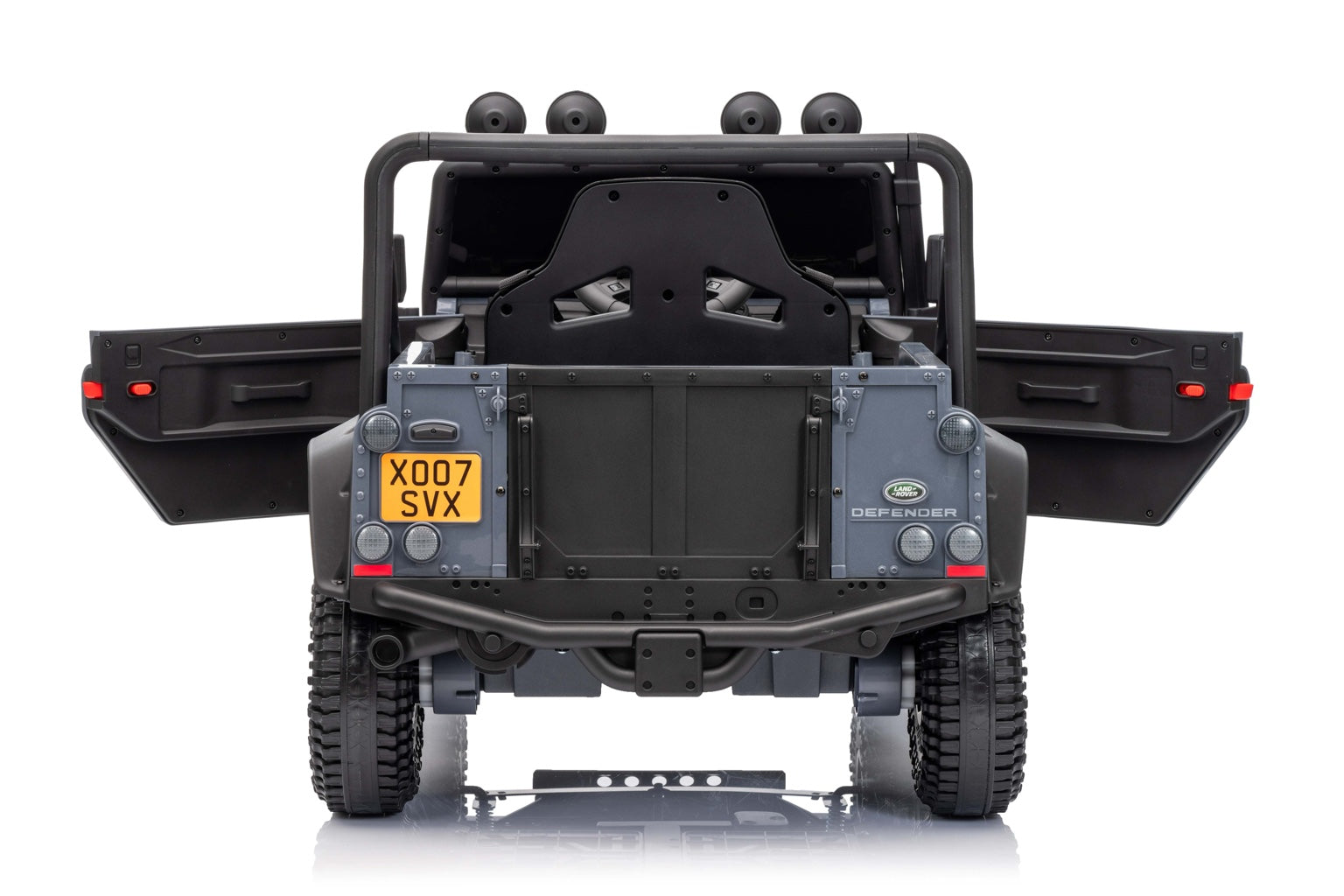 Rear angle of the licensed Land Rover Defender kids ride-on vehicle with realistic detailing and X007 SVX number plate.