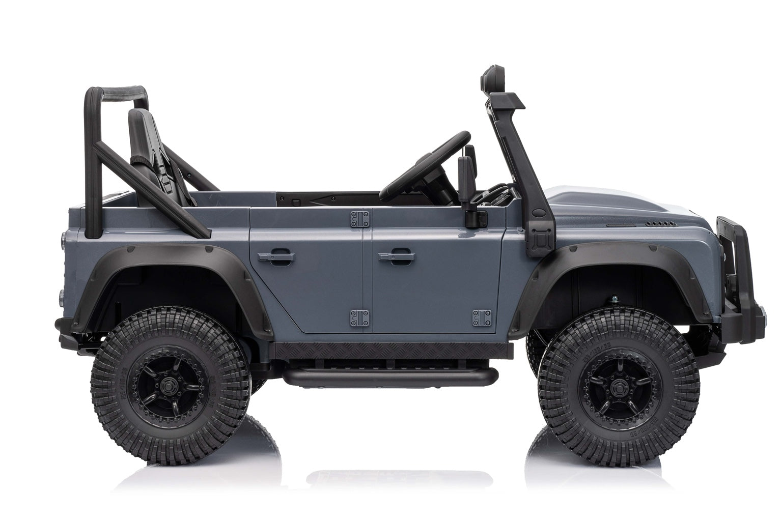 Left side view of the kids Land Rover Defender electric car with rugged tires and roll cage design.