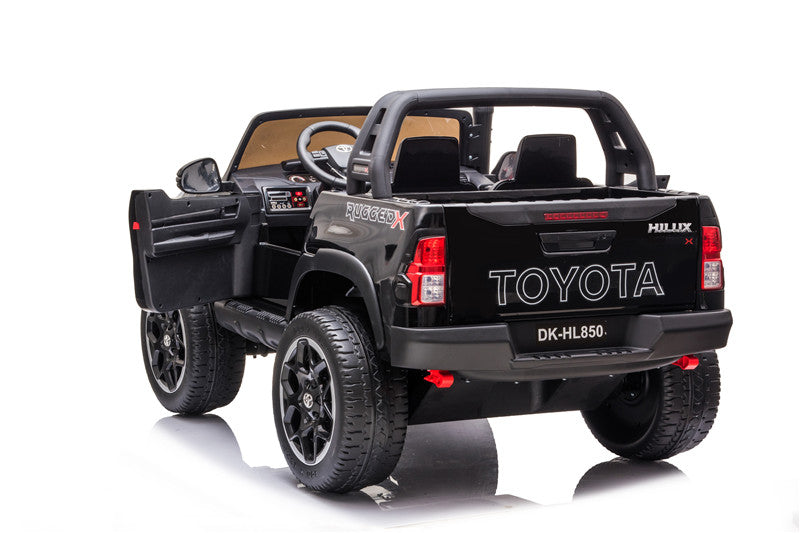 Rear-left view of the Toyota Hilux kids’ ride-on electric 4WD with both doors open.