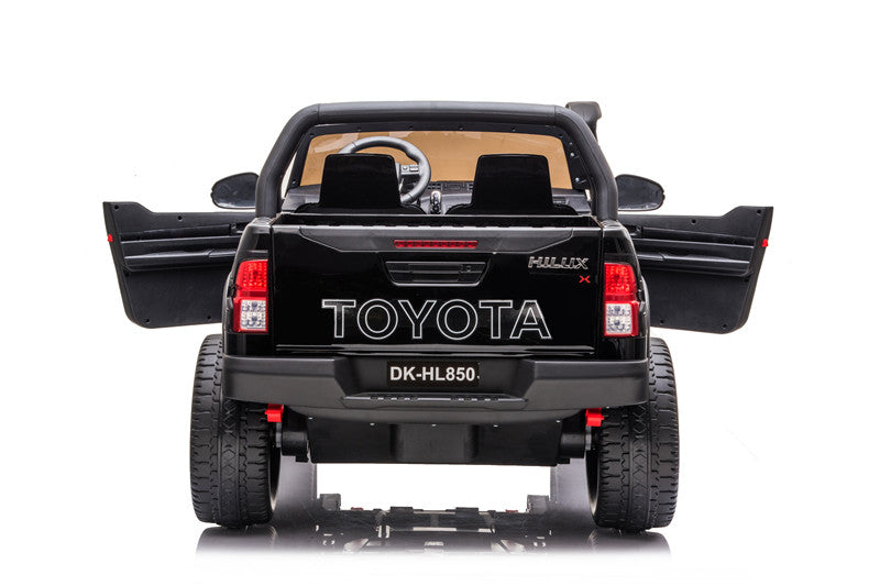 ull rear view of the Toyota Hilux kids’ 4WD ride-on with dual open doors and detailed Toyota branding.