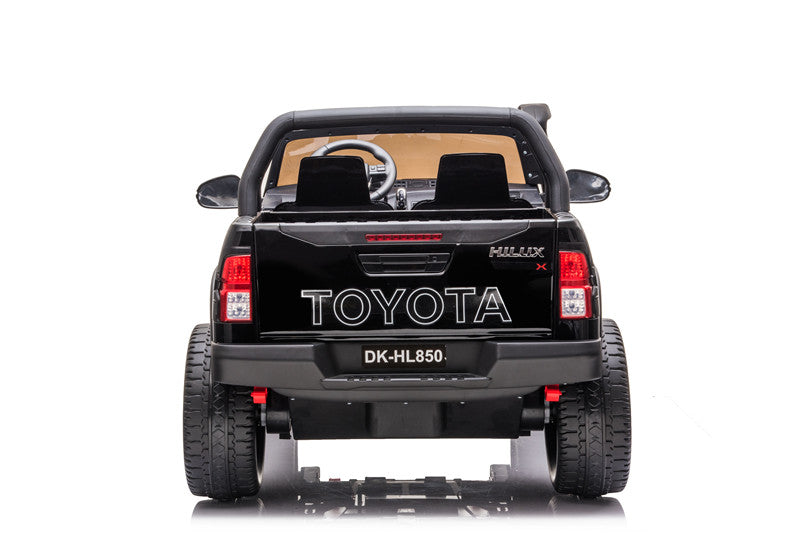 Back view of the Toyota Hilux kids’ ride-on 4WD SUV with open doors and authentic Toyota branding.