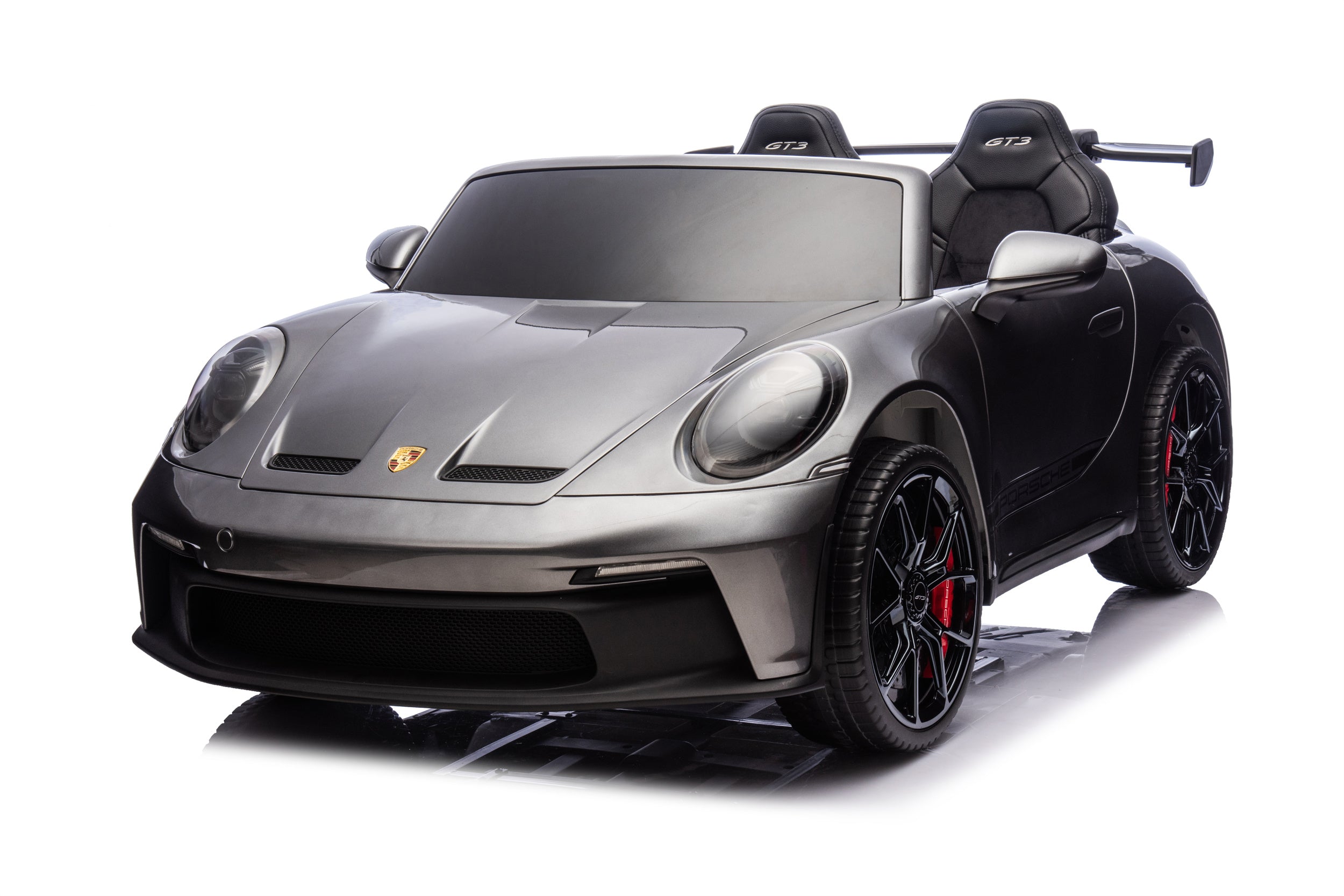 Black toy car with Porsche logo on a white background