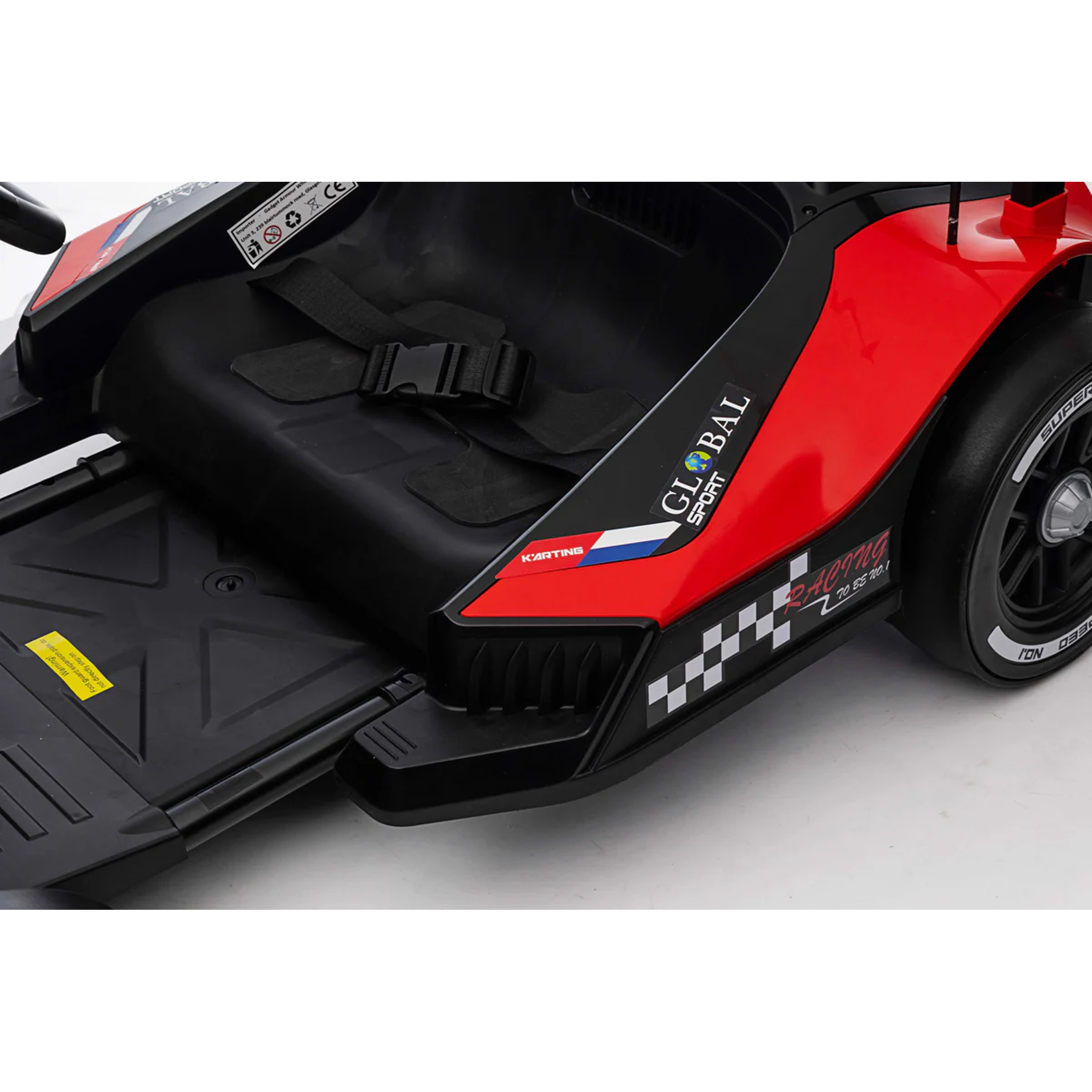 Close-up of a red and black toy car with visible branding on a white background