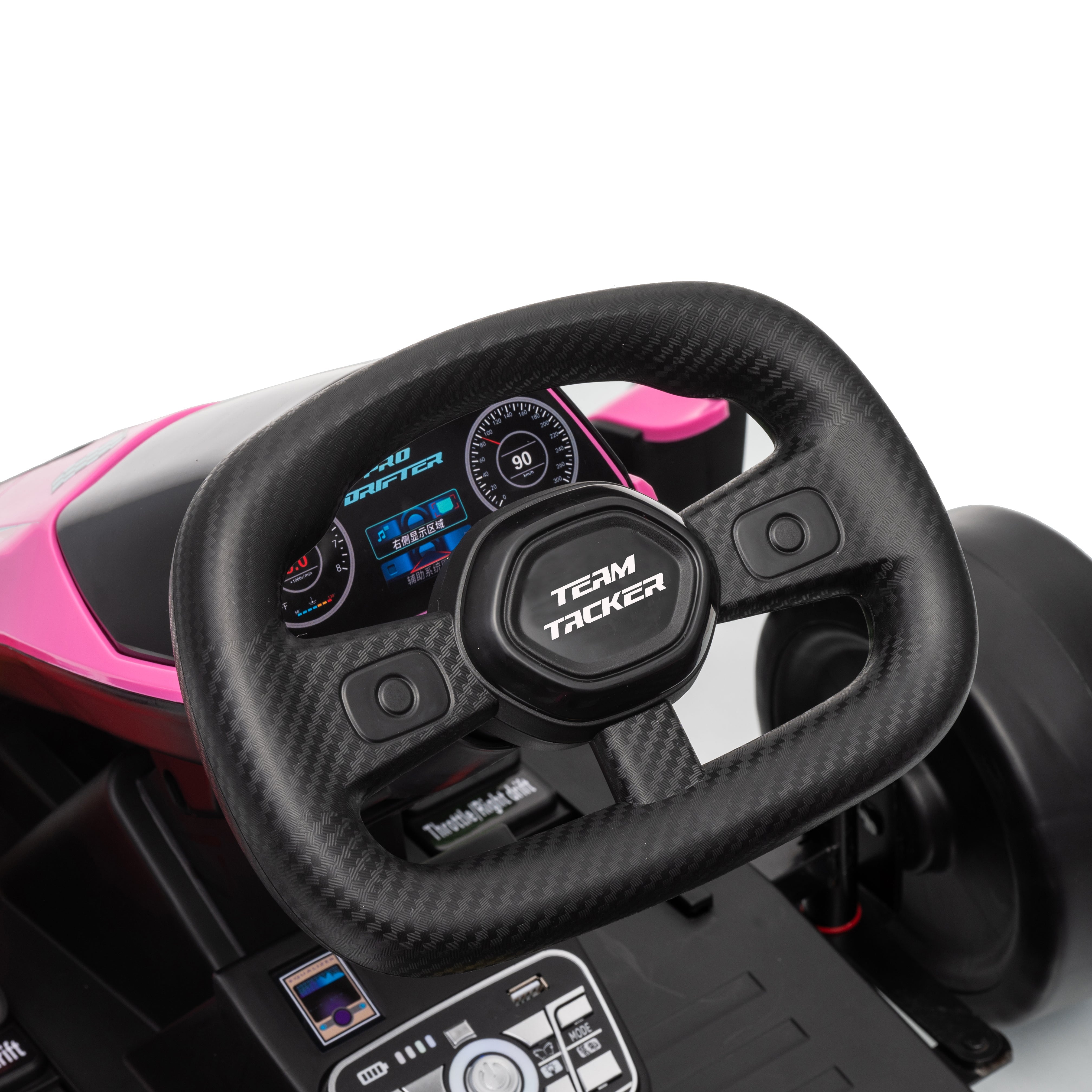 Close-up of a toy car steering wheel with digital display on a white background
