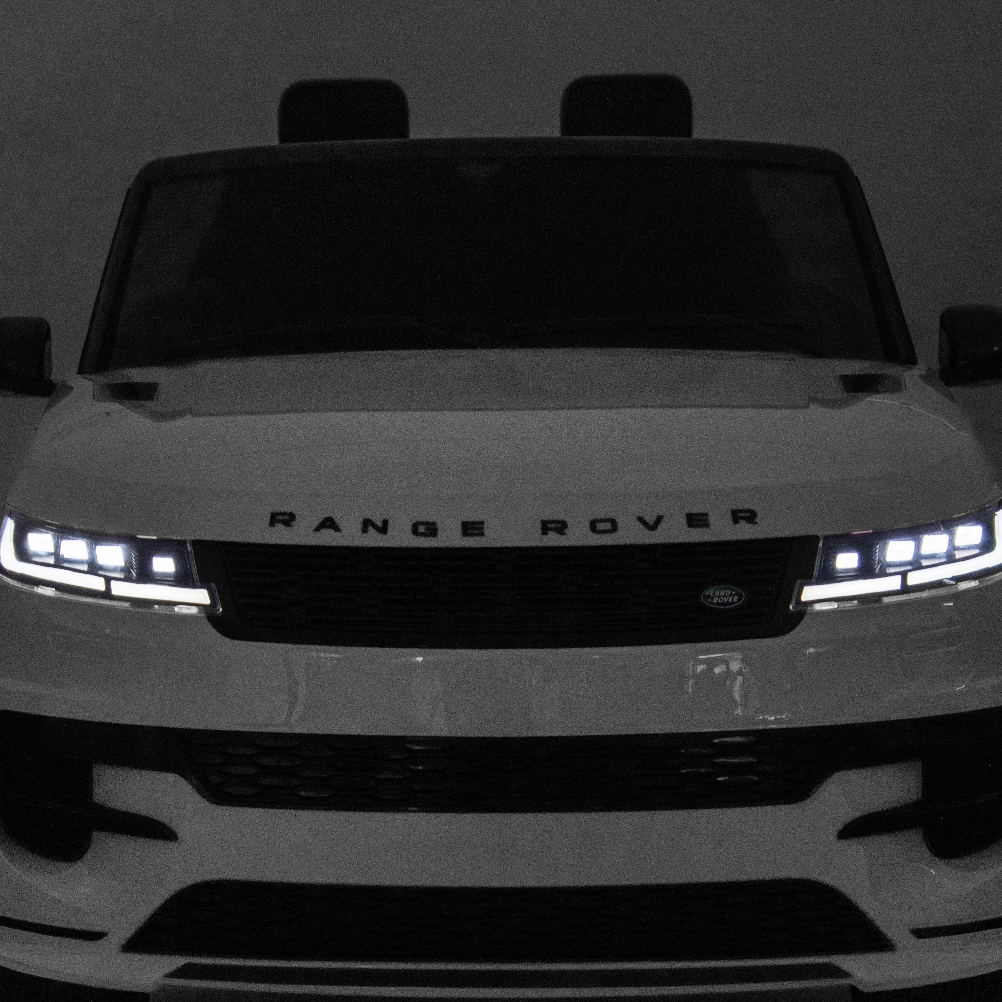 Front view of a Range Rover vehicle on a dark background