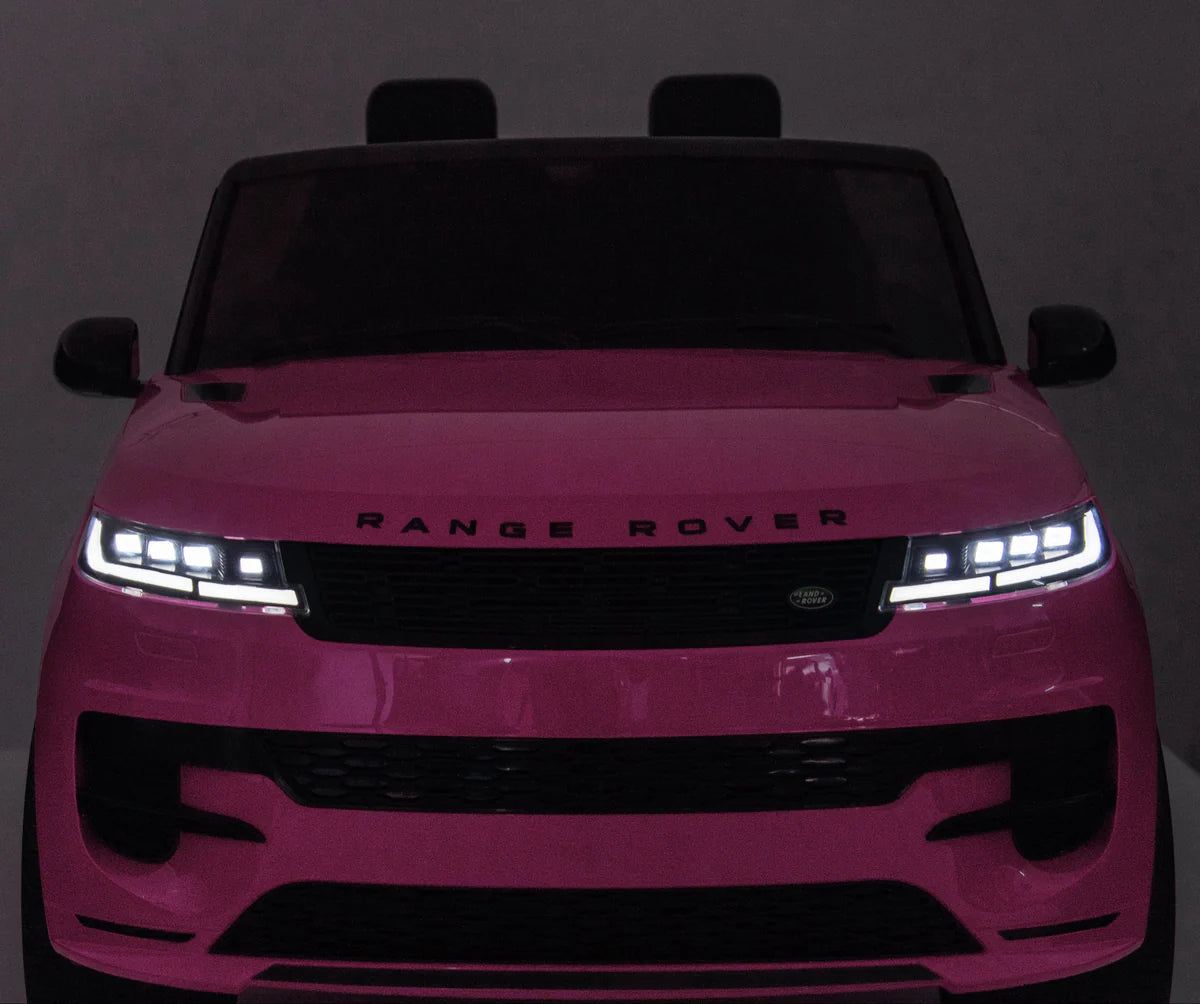 Pink Range Rover on a dark background