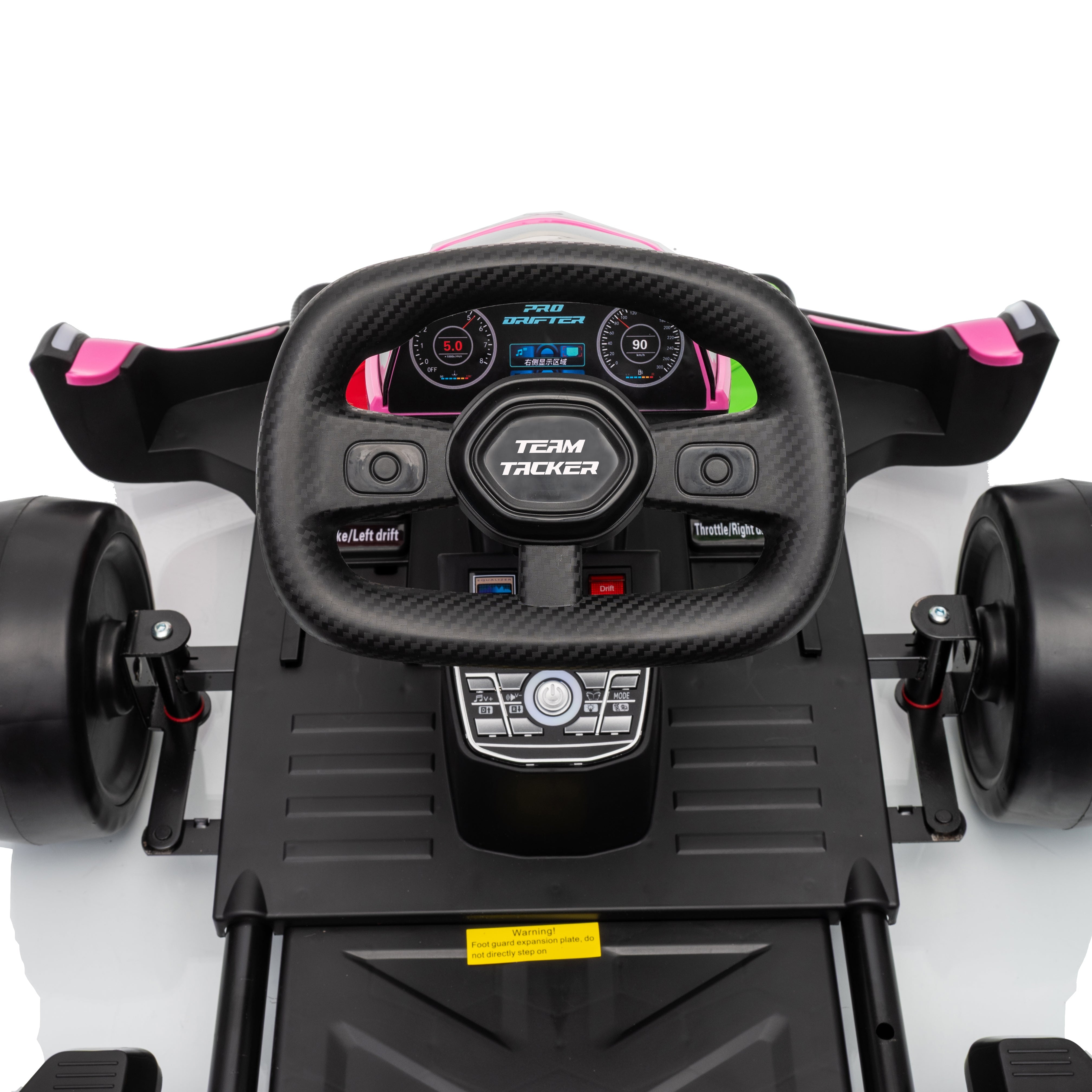 Close-up of a toy car's steering wheel and dashboard with visible branding on a white background