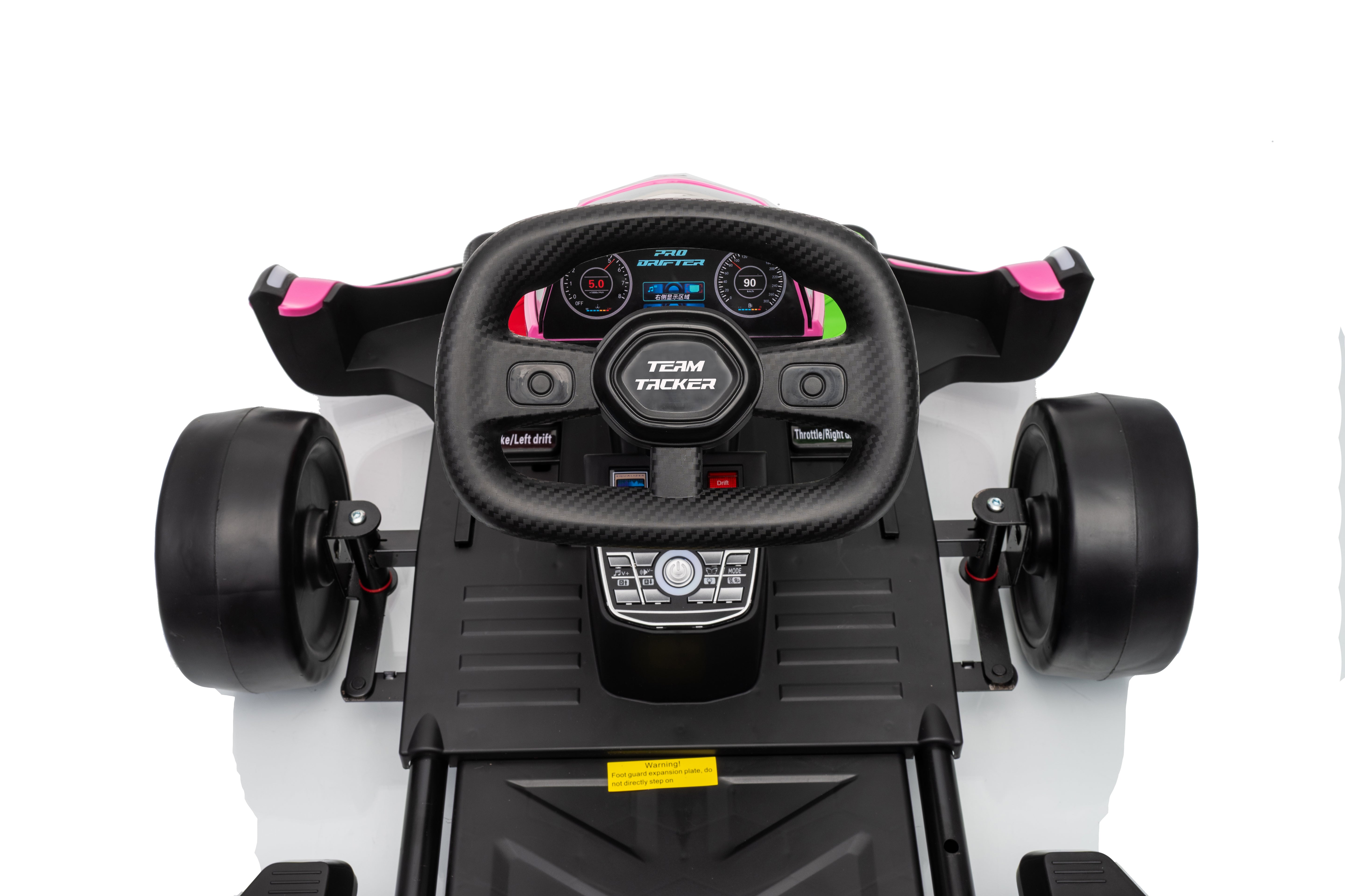 Close-up of a toy car's steering wheel and dashboard with visible branding on a white background