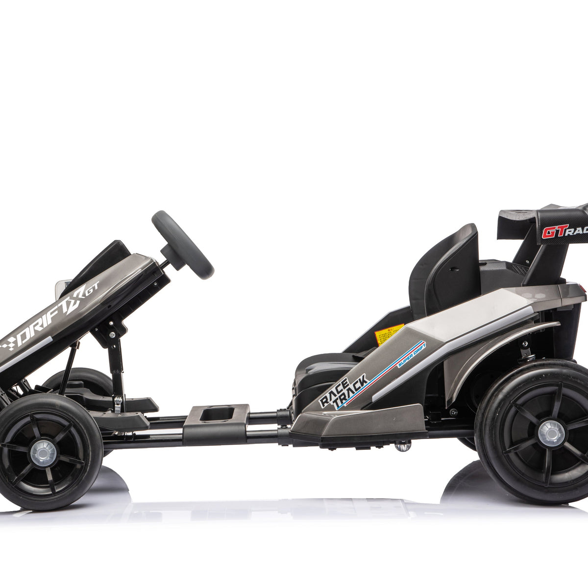A black and gray go-kart with a black steering wheel and black wheels, shown from a side profile on a white background with a reflection.