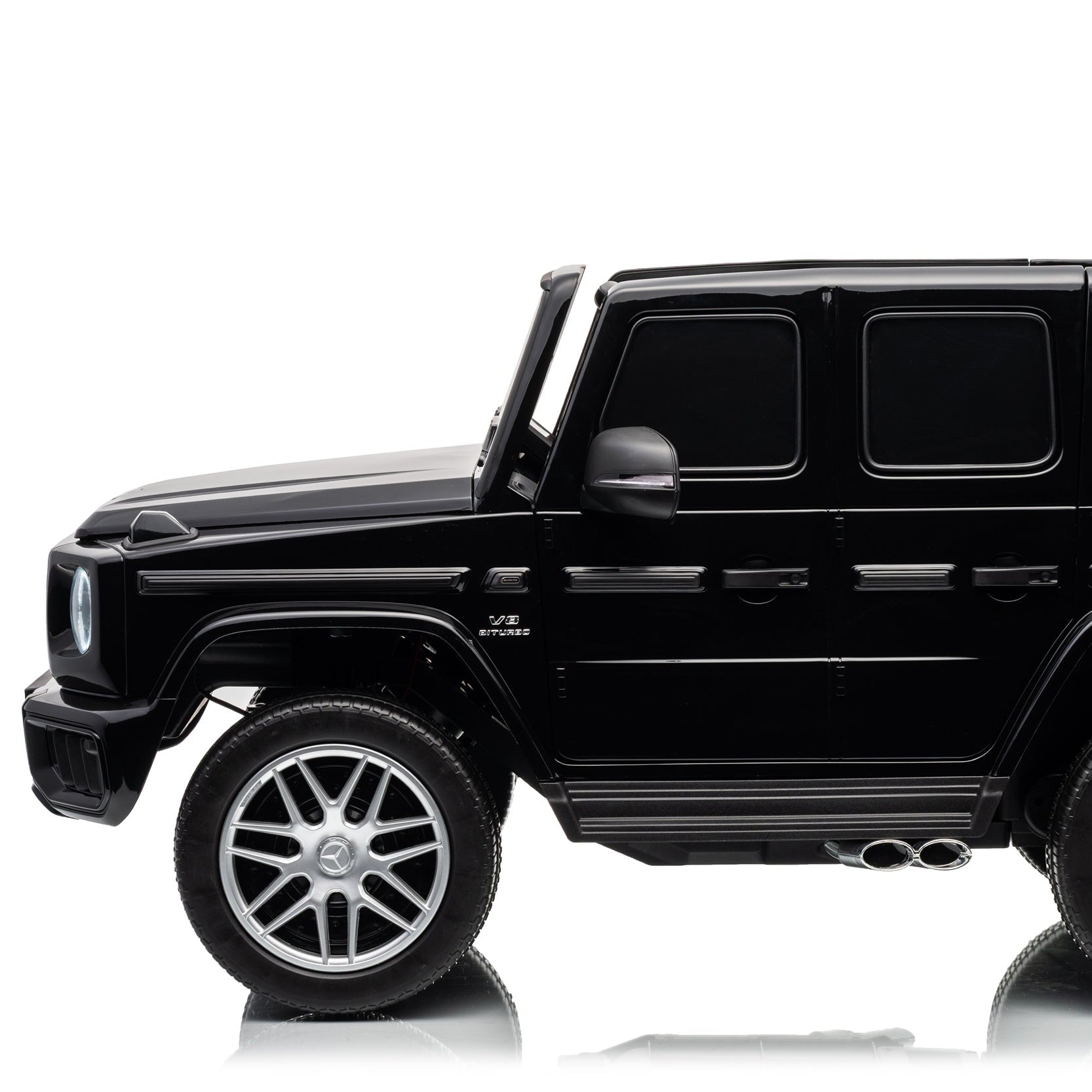A black Mercedes-Benz G-Class style SUV toy or replica shown in a side profile on a clean white studio background.