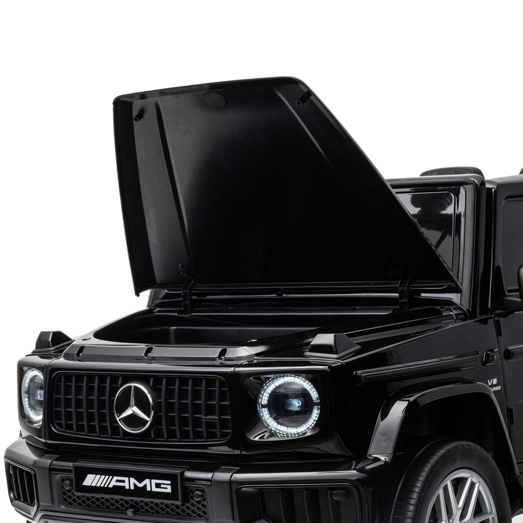 A black Mercedes-Benz AMG G-Class vehicle shown from a front three-quarter angle with its hood open, photographed against a clean white studio background.