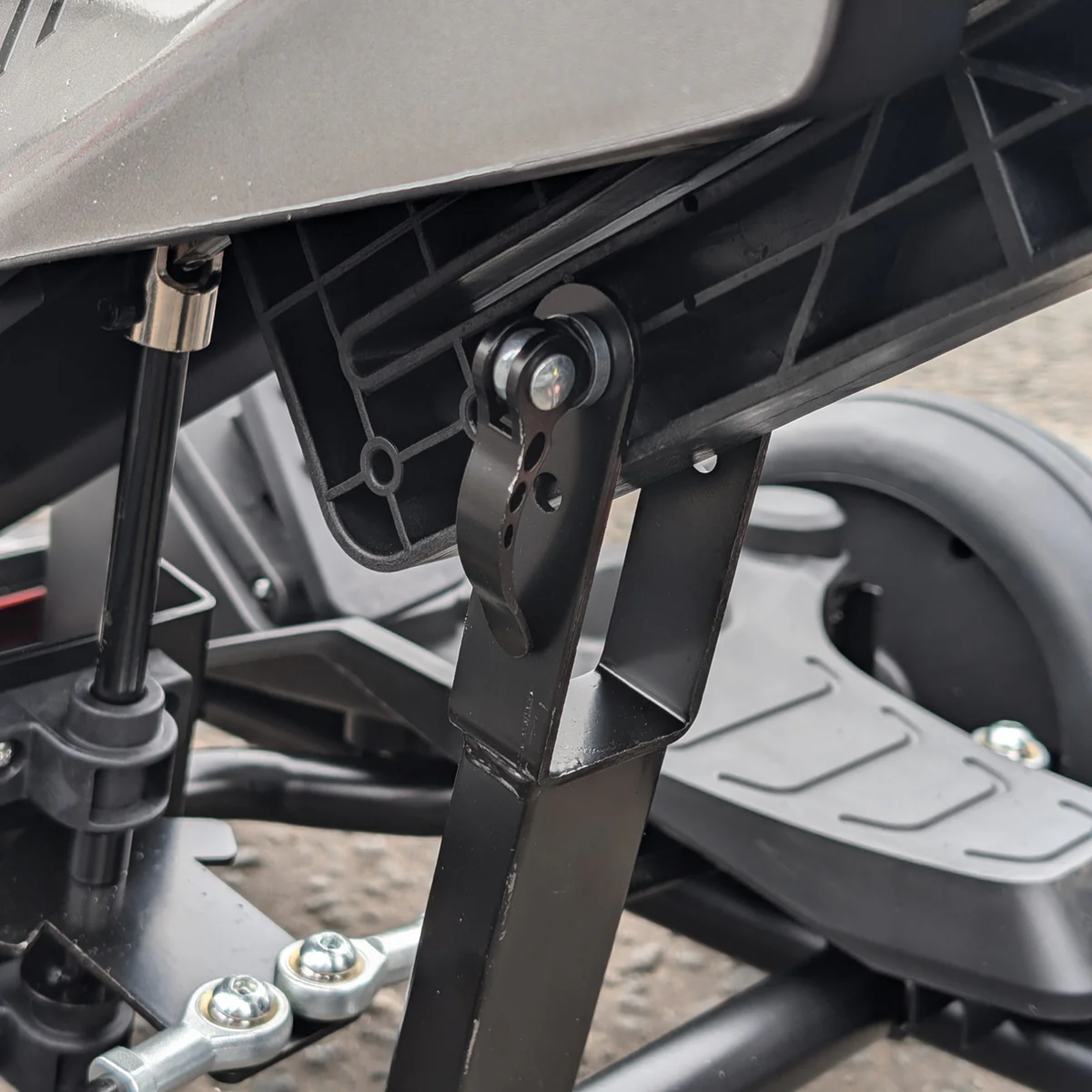 Close-up of a motorcycle's suspension system with metal components.