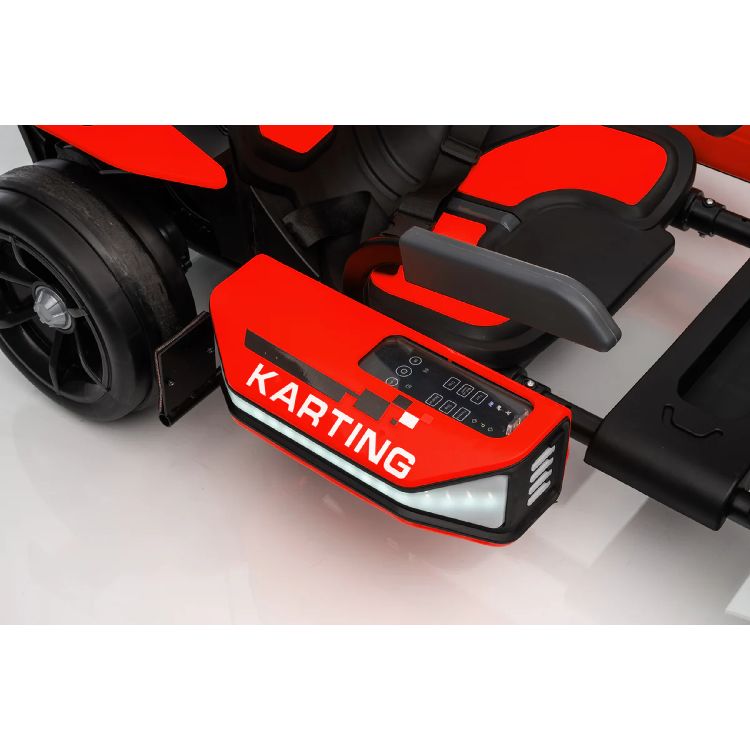 Close-up of a red and black go-kart with 'Karting' branding on a white background