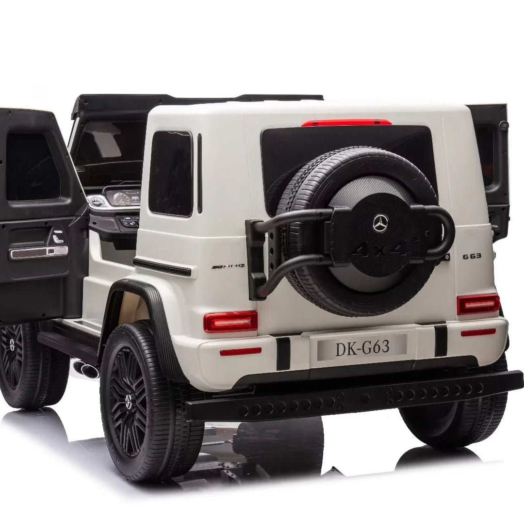 A white and black Mercedes-Benz G-Class style children's ride-on vehicle, shown from a rear three-quarter angle with the side door open, on a clean white background.