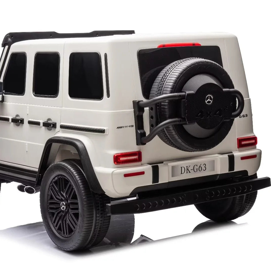 A cream-colored Mercedes-Benz G-Class style SUV ride-on toy or model, shown from a rear three-quarter angle on a clean white background.