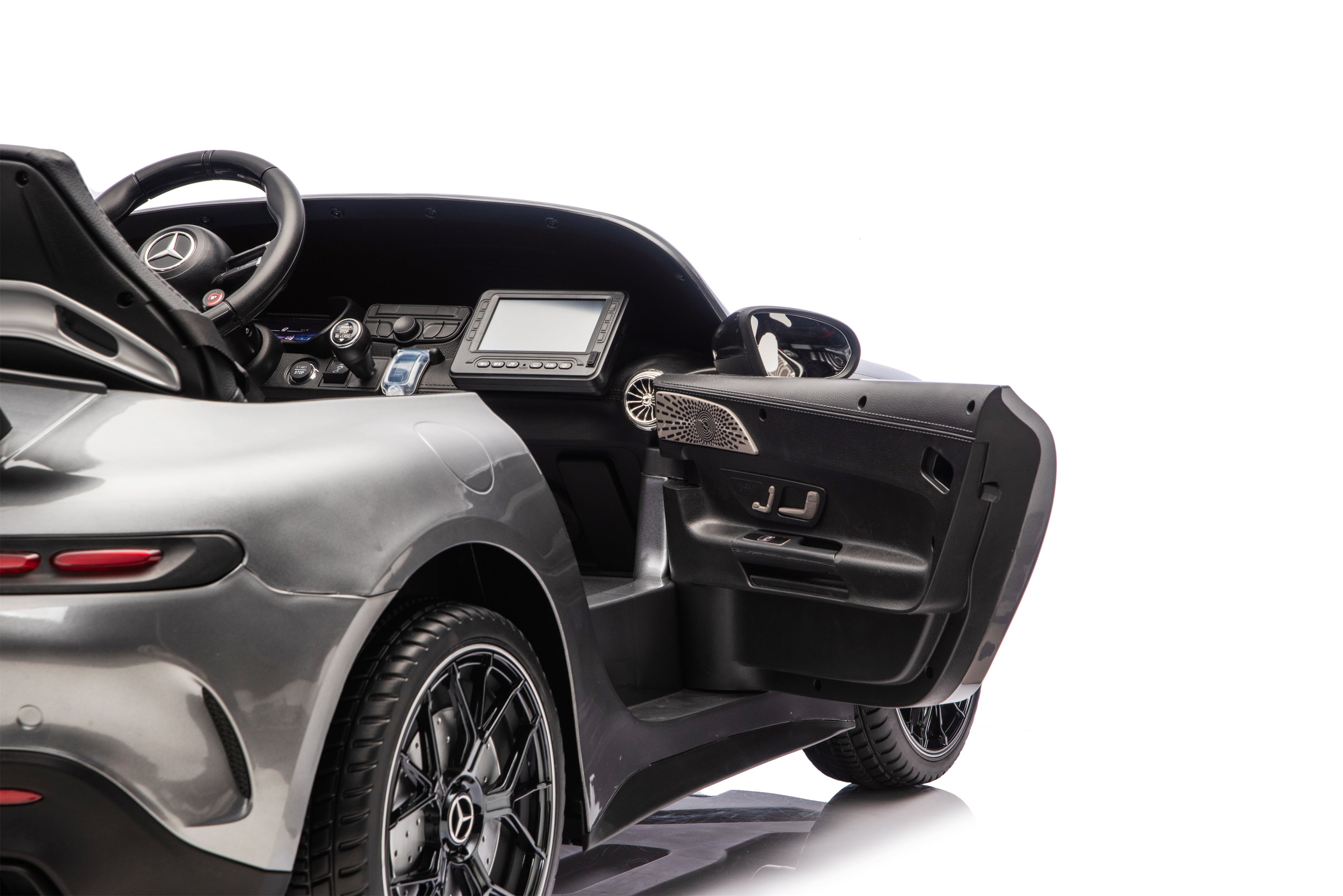 Close-up of a Mercedes-Benz car interior with open door on a white background