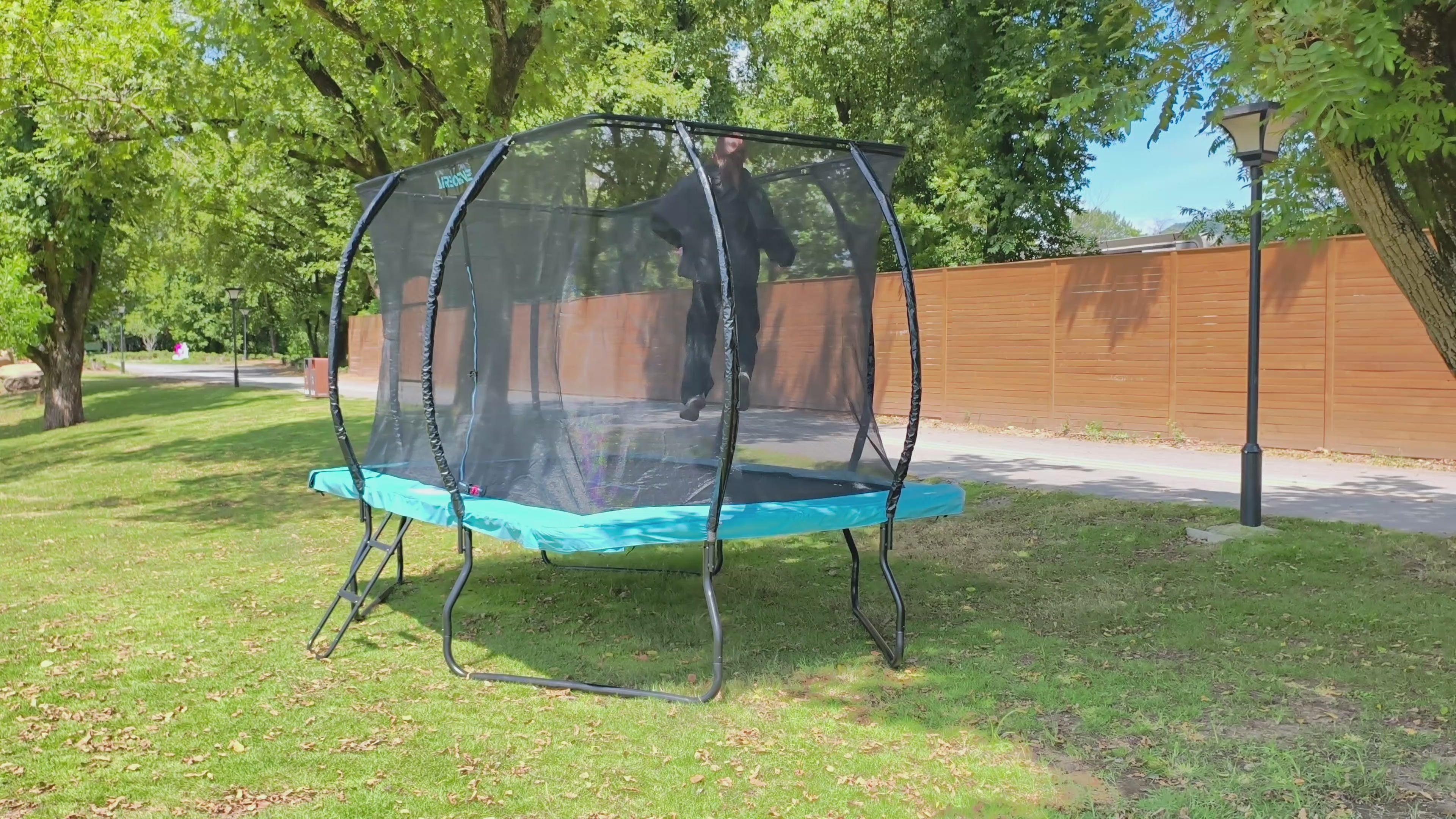 video of rectangle trampoline with child bouncing.