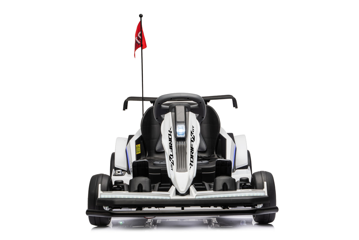 A white and black go-kart with a small red flag on a pole, photographed from the front against a solid white background.