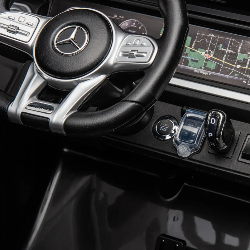 Mercedes-Benz car interior with steering wheel and dashboard controls.